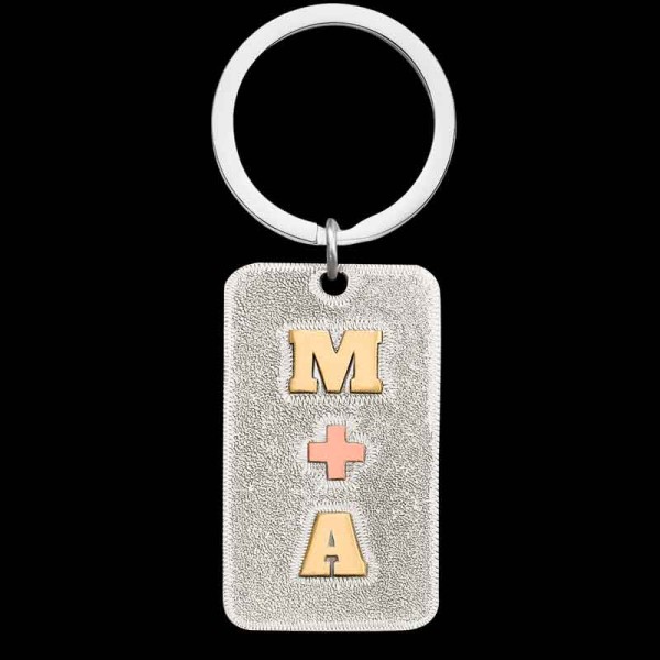 "Our City Slickers Keychain is the perfect accessory to personalize for yourself or a special someone. Crafted on a German silver base withJeweler's Bronze initials and a Copper symbol. Customize this keychain with your desired lettering and symbol b